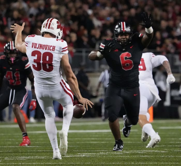 Wisconsin punter Andy Vujnovich kicking the ball against Ohio State.